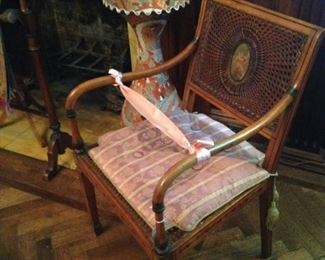 One of two Edwardian cane chairs
