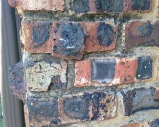 The bricks by the front door show how they look.