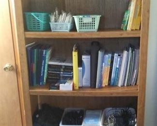 entire office full of supplies, nursing books, scissors, magnifying glasses, rulers, wrapping paper, labels, ribbon, staplers, staples, notebooks, books, notepads, purses, bags, tote bags, luggage