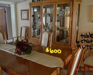 dining room set, 2 captains chairs, 4 chairs, 1 leaf, hutch sold as a set