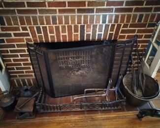 Early Americana hand forged cast iron fireplace accessories.