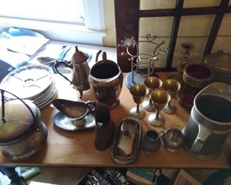 Older pewter and silver-plate.