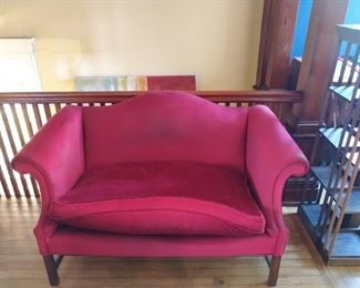 Antique loveseat needs reupholstering.