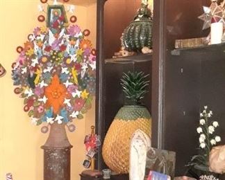 Very large colorful tree of life, ;arge vintage Michoacan pineapple pottery, and a 15 foot bookcase.