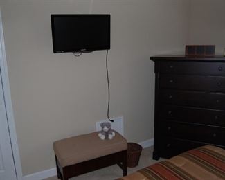 flat screen tv, bench with a hidden compartment