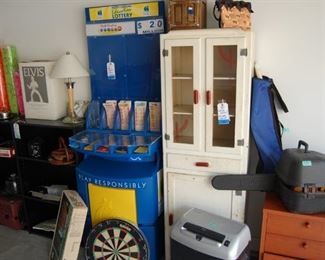 Lottery Booth, vintage kitchen cabinet , chain saw,