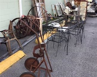Antique hand trucks and wrought iron furniture