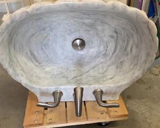 Marble pedestal sea shell sink
