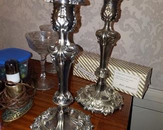 Pairs of ornate silver plated candle holders 