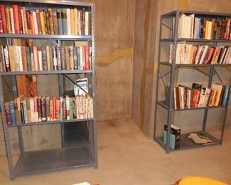 Books; metal shelving (there's a third shelf unit behind the one on the left)