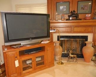 50" LG TV; LG sound system; TV cabinet; décor items