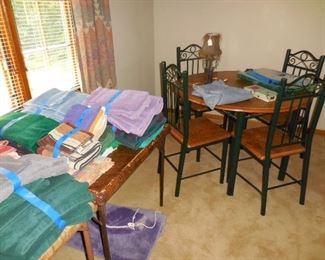 Small metal and wood table and chairs; bathroom linens