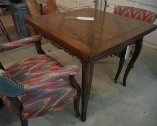 Table has top that folds out to double size; 2 of 4 chairs set