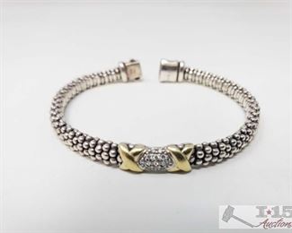 866: 	
Lagos 18k gold with Diamonds Sterling Silver Braclet
Lagos 18k gold with Diamonds Sterling Silver Bracelet. Weighs approx. 24g.
OS19-017630.19