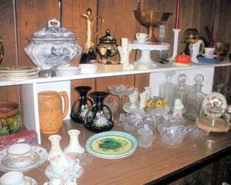 Cut Crystal Glass, Belleek, Weller, Hand Painted, Majolica, Pottery, Crystal Decanters....trust me these tables and others will be full once we finish sorting and unpacking.