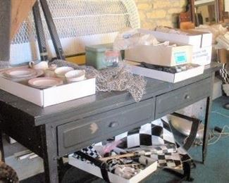 Several mid century industrial metal furniture...I could see this table as a kitchen island in a loft condo downtown Indy.