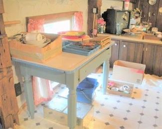Enameled top Kitchen Table....shelves, counters and table top are full of treasures....don't overlook the floors and walls for more treasures. 