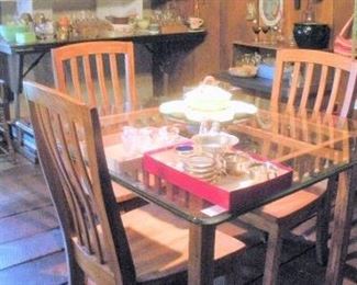 Wonderful mission style glass top table and 4 matching chairs.