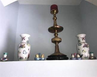 There is a pair of he brass large candlesticks 