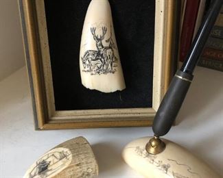 Several pieces of scrimshaw items
