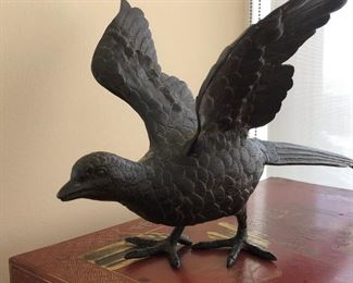 Patinated sculpture of spread-wing bird