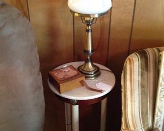 Round accent table with marble base, set of coasters in box, small table lamp