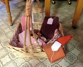 Basket full of vintage cloth napkins and napkin rings