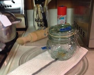 Decorative jar with utensils,vintage rolling pen, glass tray that fits in microwave, nice kitchen towel, decorative jar
