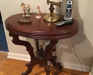 Antique side table, 2 Hummel figurines