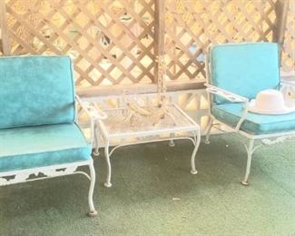 Two retro loungers and table