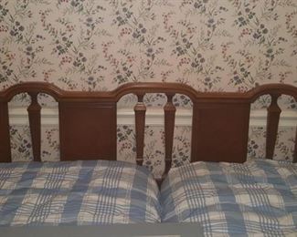King size headboard with Stein beds that swivel so making it up easier. Mattresses and box springs included.