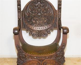 The Stomps Burkhardt Furniture Co. Lion Chair.  Antique Carved Oak Wood Detail, Lions @ Top Of ea. Side, Leather Curved Seat w/Brass Brads (48"h x 27"w x 22"d):  $600.00 