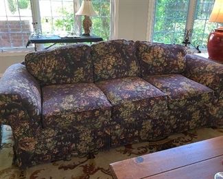 1 of 2 matching floral 3 cushioned Sofa