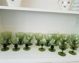 Large set of green glass stemware