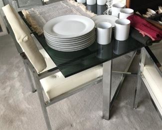 Smoke Glass Table with Chrome Plated legs, 4 White leather chairs.