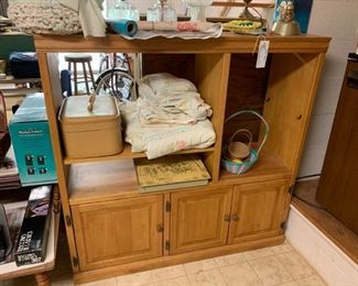 #43		wood entertainment center w 3 doors and shelves 48x16x48	 $35.00 
