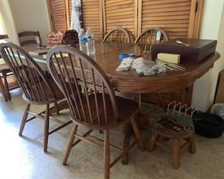 #12		double pedistal oak table as is top  w 1 leaf and 4 chairs 60-78x30	 $175.00 

