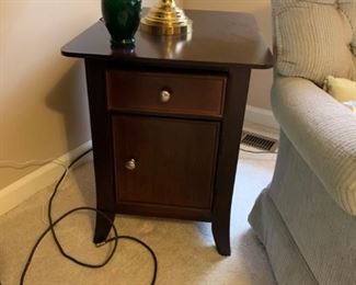 #16 black base wood top end table w 1 drawer and 1 door $75.00