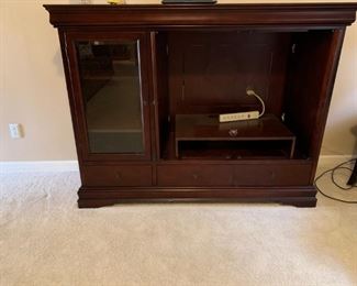 #15		entertainment cabinet w 3 drawers 1 glass door and 2 hid doors 65x22x50	 $75.00 
