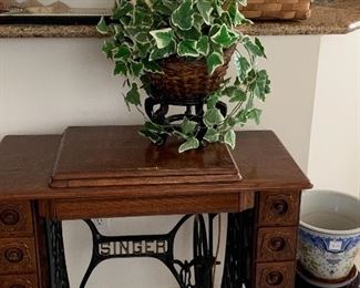 Antique Singer sewing machine and cabinet