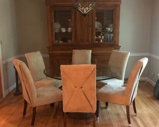 Pineapple base, glass top dining table with 6 chairs. Table measures 54” round.