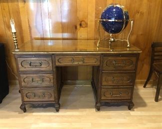 Baker desk. Measures approximately 25” deep by 56” across and 31 1/2” tall.