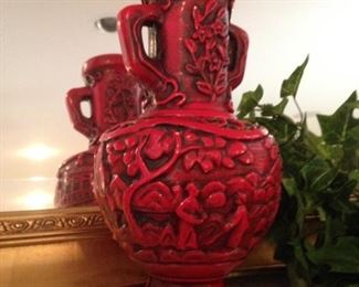 One of two red Asian style vases