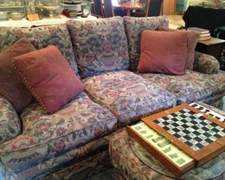 The sofa has a matching chair and ottoman.