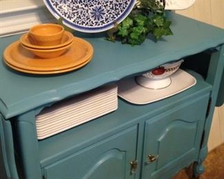 Drop-leaf server with display and storage areas