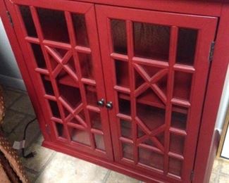 Red cabinet with decorative front 