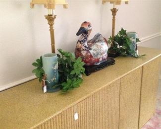 This entry credenza is quite unique with its curved ends. It can easily serve, as well, as a buffet or sofa table. Selections also include the duck tureen and matching lamps.