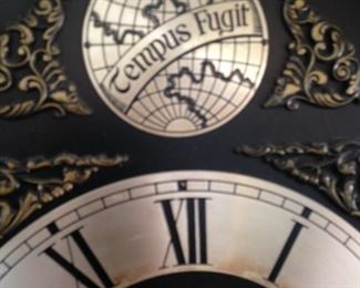 "Tempus Fugit" (Tempus Fugit is Latin for “time flies.” It is a whimsical motto that clock companies started adding to clock dials in the 1940's and 1950's, but increased in popularity in the 1970's and later.)