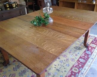 This antique claw foot table has FOUR more leaves!
