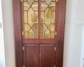 Corner cabinet.  Inside painted yellow.